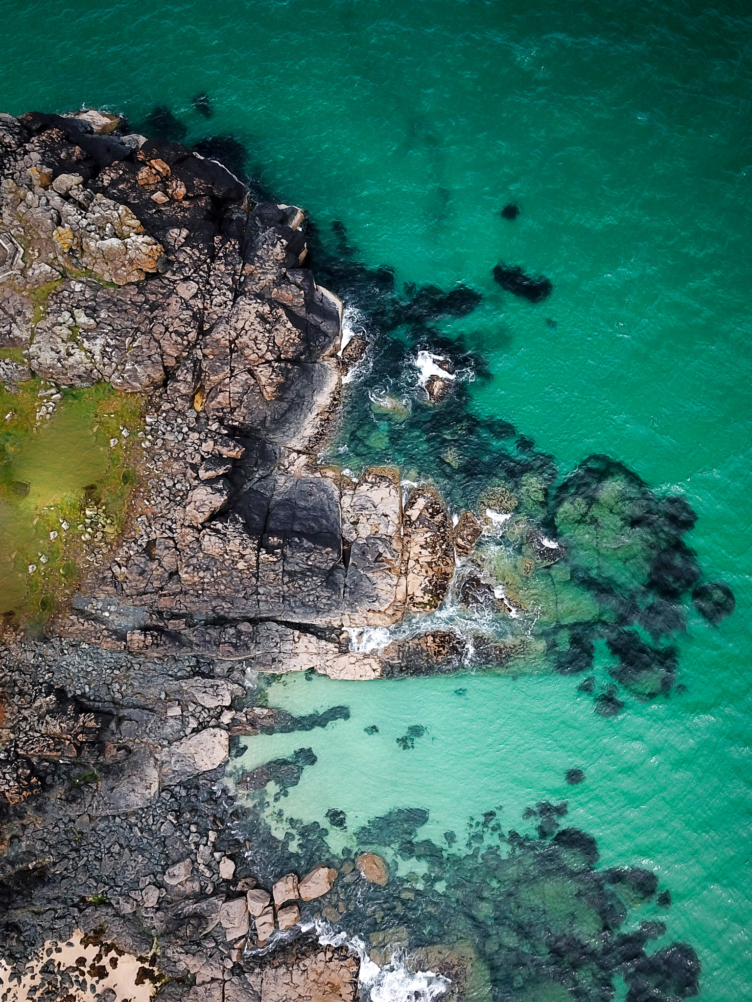 Rocky coastline turquoise aerial